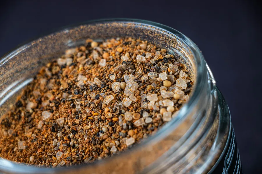 Close-up of a spice blend in a glass jar