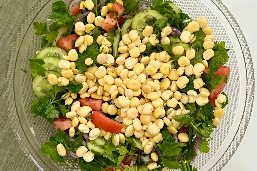 Fresh bean and vegetable salad in a glass bowl
