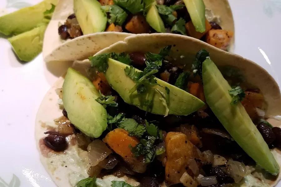 Sweet potato black bean tacos with avocado and cilantro